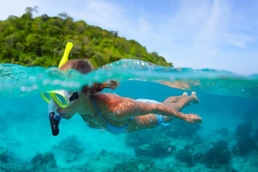 A woman is snorkling in the ocean of SAN JOSECITO