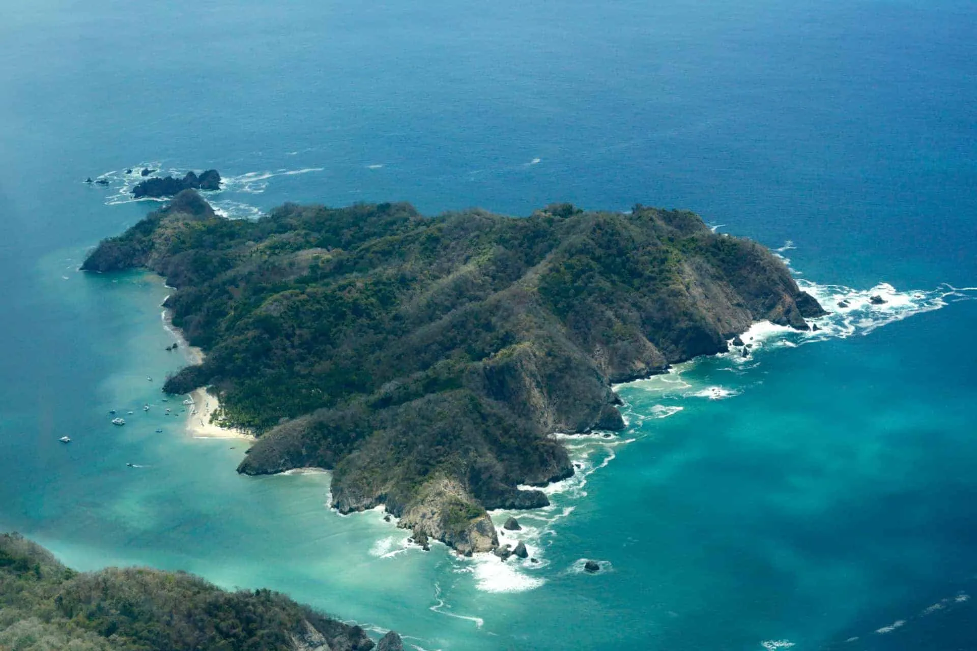 An aerial view of Cano Island in the ocean.