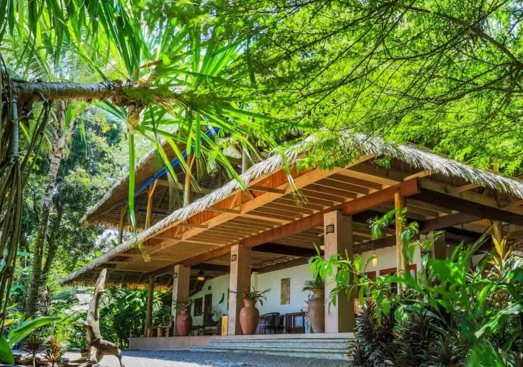 A Corcovado National Park Resort by tropical plants and trees.